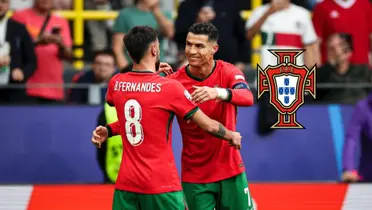 Cristiano Ronaldo and Bruno Fernandes celebrate together after Portugal's third goal and the Portugal national team badge is next to them. (Source: Al Nassr Zone X)