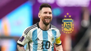 Lionel Messi smiles while wearing the Argentina jersey and the Argentina national team badge is next to him. (Getty Images, FIFA)